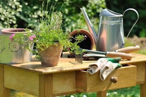 Gardener discussing a garden task with a homeowner